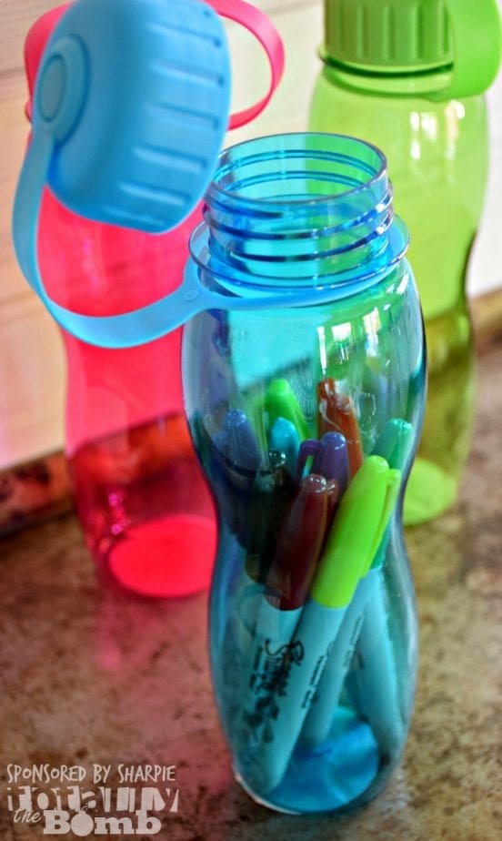 sharpie pens inside a water bottle