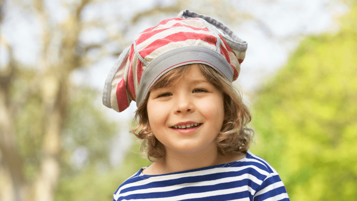 little boy with underwear on head