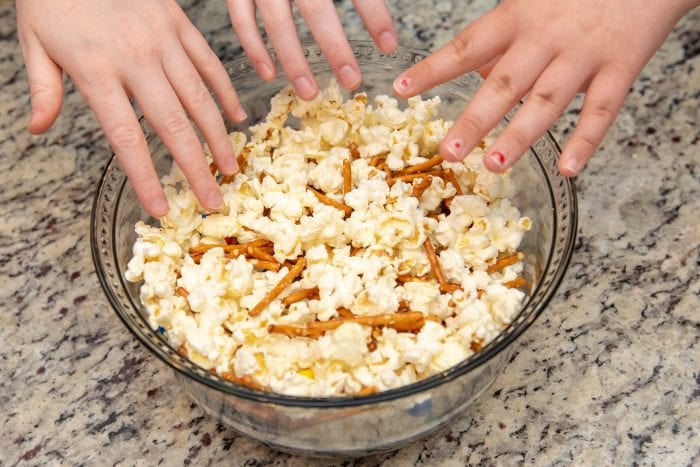 kids reaching for popcorn