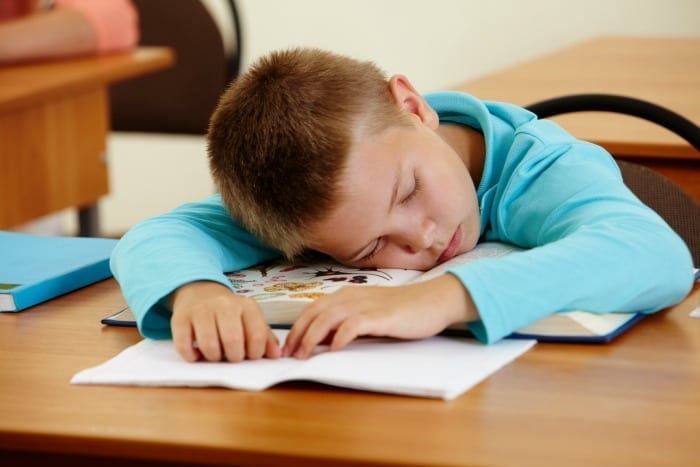 sleeping kid at school