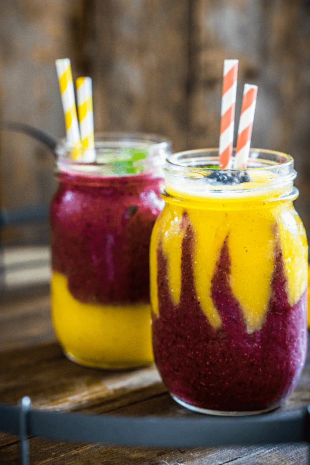 Have you ever been hyper-aware that you needed a pick-me-up in a bad way? Dude, this Pick-Me-Up Guaranteed Mango-Berry Smoothie is the solution for that problem. #smoothie #fruit #drink #breakfast