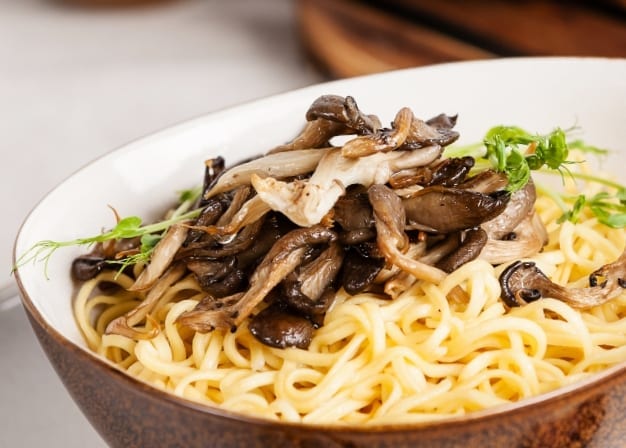 a quick dinner is less than ten minutes away with this delicious Oyster Mushroom Ramen Soup recipe