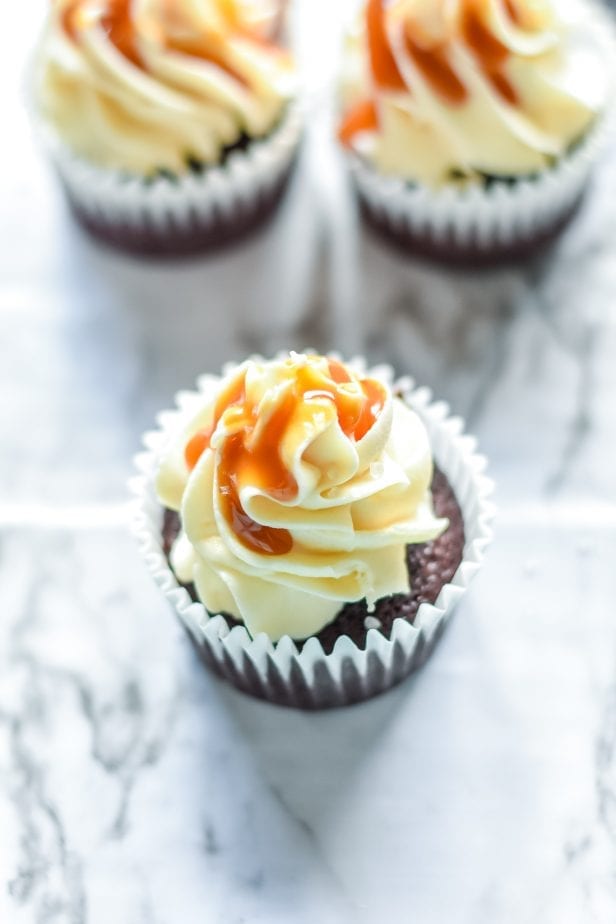 If you were hoping for a classic death-by-dessert, let me assure you that these decadent and creamy Salted Caramel Cupcakes deliver. #saltedcaramel #saltedcaramelcake #saltedcaramelcupckes #caramel