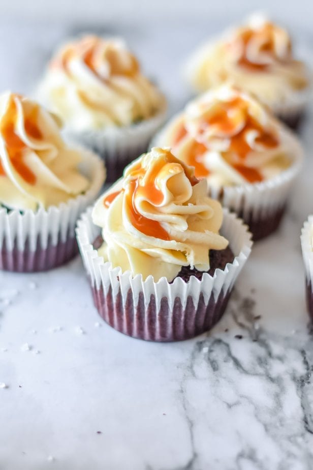 If you were hoping for a classic death-by-dessert, let me assure you that these decadent and creamy Salted Caramel Cupcakes deliver. #saltedcaramel #saltedcaramelcake #saltedcaramelcupckes #caramel