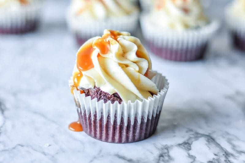 If you were hoping for a classic death-by-dessert, let me assure you that these decadent and creamy Salted Caramel Cupcakes deliver. #saltedcaramel #saltedcaramelcake #saltedcaramelcupckes #caramel