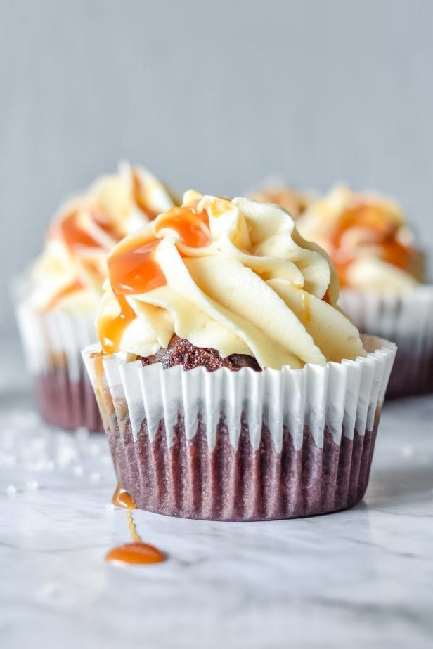 If you were hoping for a classic death-by-dessert, let me assure you that these decadent and creamy Salted Caramel Cupcakes deliver. #saltedcaramel #saltedcaramelcake #saltedcaramelcupckes #caramel