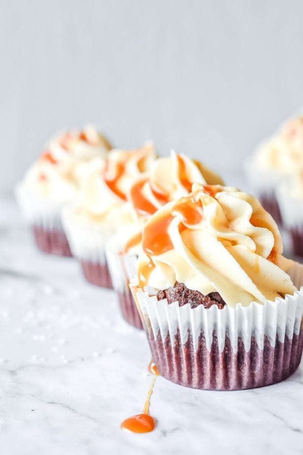 If you were hoping for a classic death-by-dessert, let me assure you that these decadent and creamy Salted Caramel Cupcakes deliver. #saltedcaramel #saltedcaramelcake #saltedcaramelcupckes #caramel