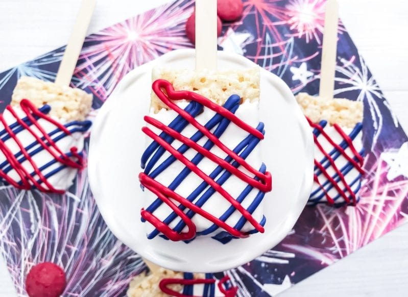 One of the best things about summer is July 4th. And these Patriotic Rice Krispie Treats are the perfect patriotic celebration treat! #bbq #summer #july4th #july4threcipe #patrioticfood #ricekrispietreats