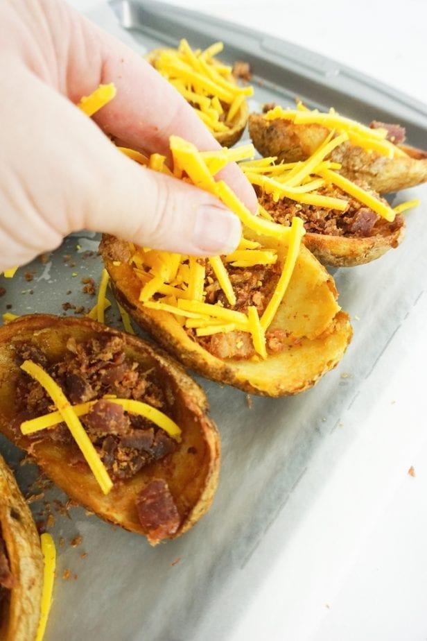 These 15-Minute Loaded Potato Skins are the Appetizer of Your Dreams. Seriously. If you have a party or you just like to eat 'skins for meal (like me), these are so fast, they'll be your new favorite recipe. #potatoskins #loadedpotatoskins #appetizer #partyfood