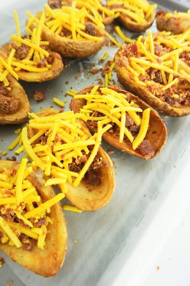 These 15-Minute Loaded Potato Skins are the Appetizer of Your Dreams. Seriously. If you have a party or you just like to eat 'skins for meal (like me), these are so fast, they'll be your new favorite recipe. #potatoskins #loadedpotatoskins #appetizer #partyfood