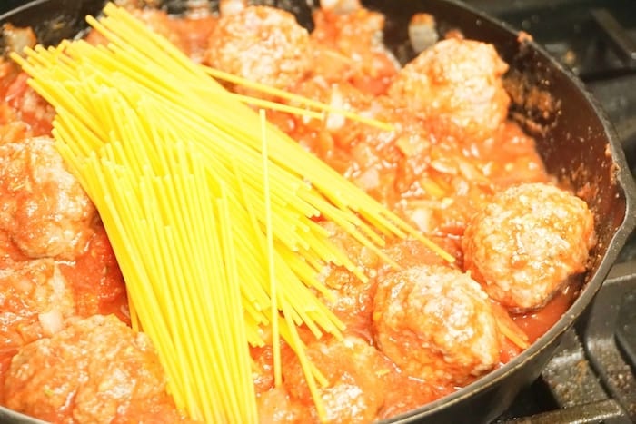 Skillet Spaghetti and Meatballs is the One-Pot Meal You've Waited Your Whole Life For. Not only is it ridiculously good comfort food, but it's easy to make and kind of fun. #onepanmeals #onepotmeals #skilletmeals #skilletspaghetti #spaghettiandmeatballs #meatballs