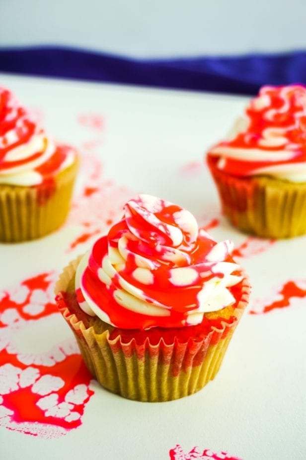 Having a little mini-watch party for my favorite zombie show inspired these Santa Clarita Diet Cupcakes, and, dude, are they awesome! #santaclaritadiet #zombie #zombiecupcake #bloodycupcake #halloween