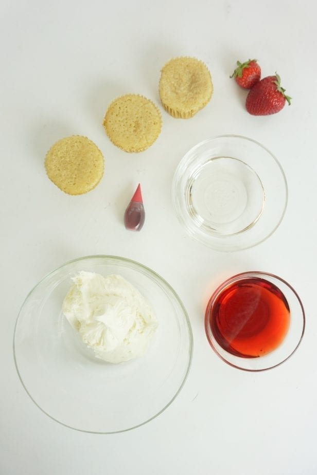I am not kidding, for a little girl's night-in, these Boozy Strawberry Liqueur Cupcakes are so perfect. I die. #boozycupcake #drunkcupcake #strawberrycupcake #cupcake