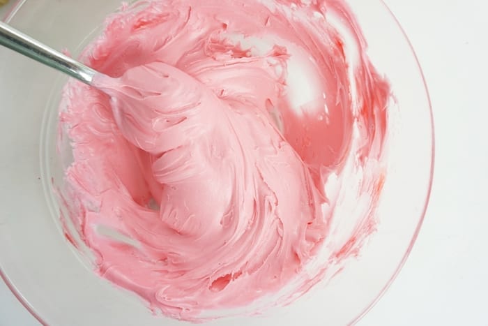 I am not kidding, for a little girl's night-in, these Boozy Strawberry Cupcakes are so perfect. I die. #boozycupcake #drunkcupcake #strawberrycupcake #cupcake