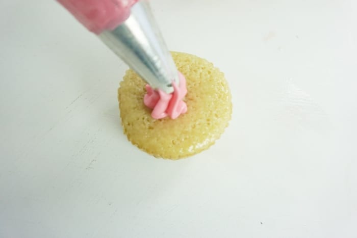 I am not kidding, for a little girl's night-in, these Boozy Strawberry Cupcakes are so perfect. I die. #boozycupcake #drunkcupcake #strawberrycupcake #cupcake