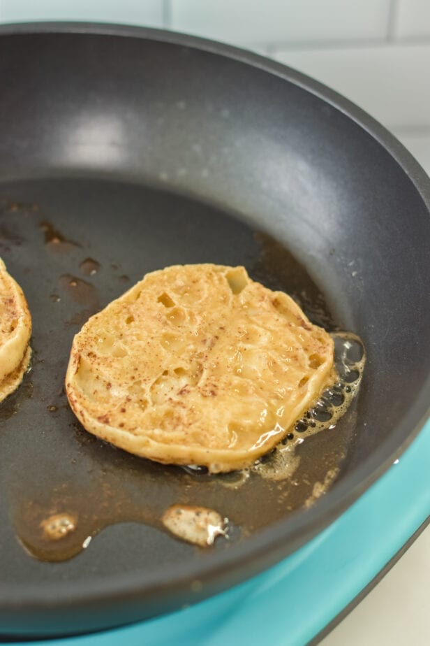 english muffins cooking in a skillet