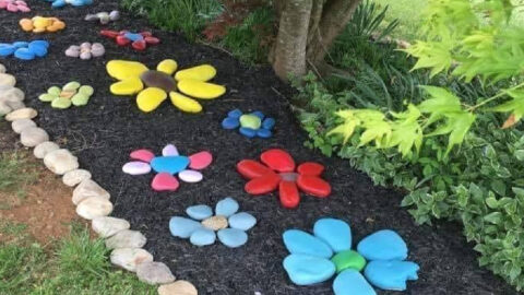 People Are Painting Rocks To Make A Fake Flower Garden And It’s Genius