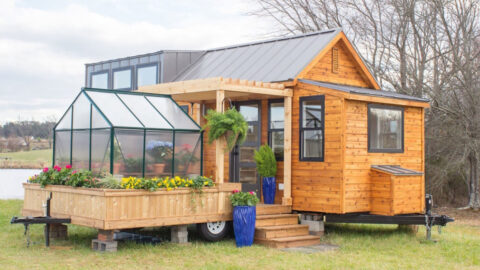 This Tiny House Comes Complete With A Porch and Greenhouse Making It A Gardener’s Dream