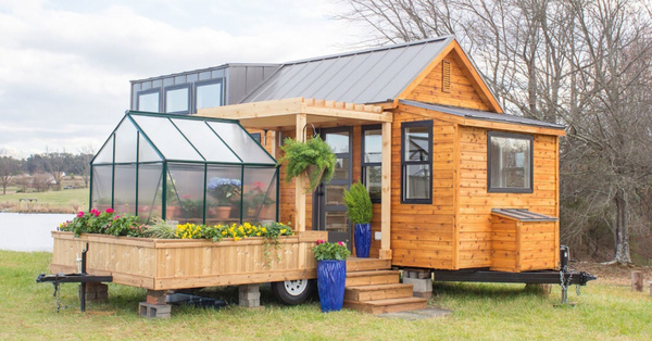 This Tiny House Is A Gardener's Dream, It Has A Porch And A Greenhouse!