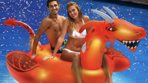 This Inflatable Dragon Pool Float Lights Up the Night So You Can Swim Even When It’s Dark Out