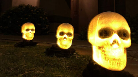 These Light Up Skeleton Heads Are the Perfect Decor to Place Alongside Your Driveway for Spooky Season