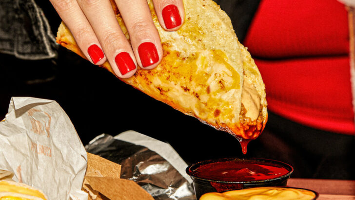 Taco Bell Just Dropped A Birria-Inspired Taco With a Crispy Cheese Outer Layer and Two Dipping Sauces