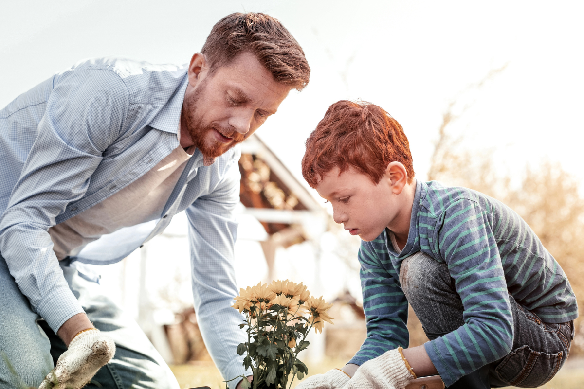 Man and young boy gardening.