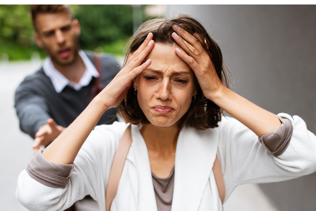 woman walking away from a man upset