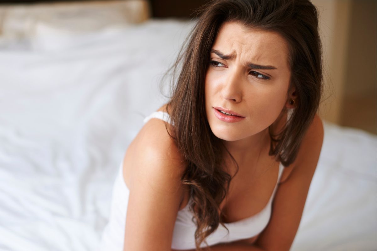 woman looking unwell