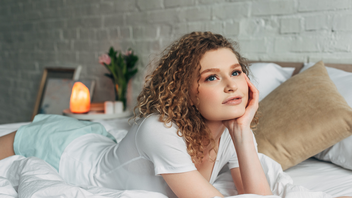 woman lying on bed