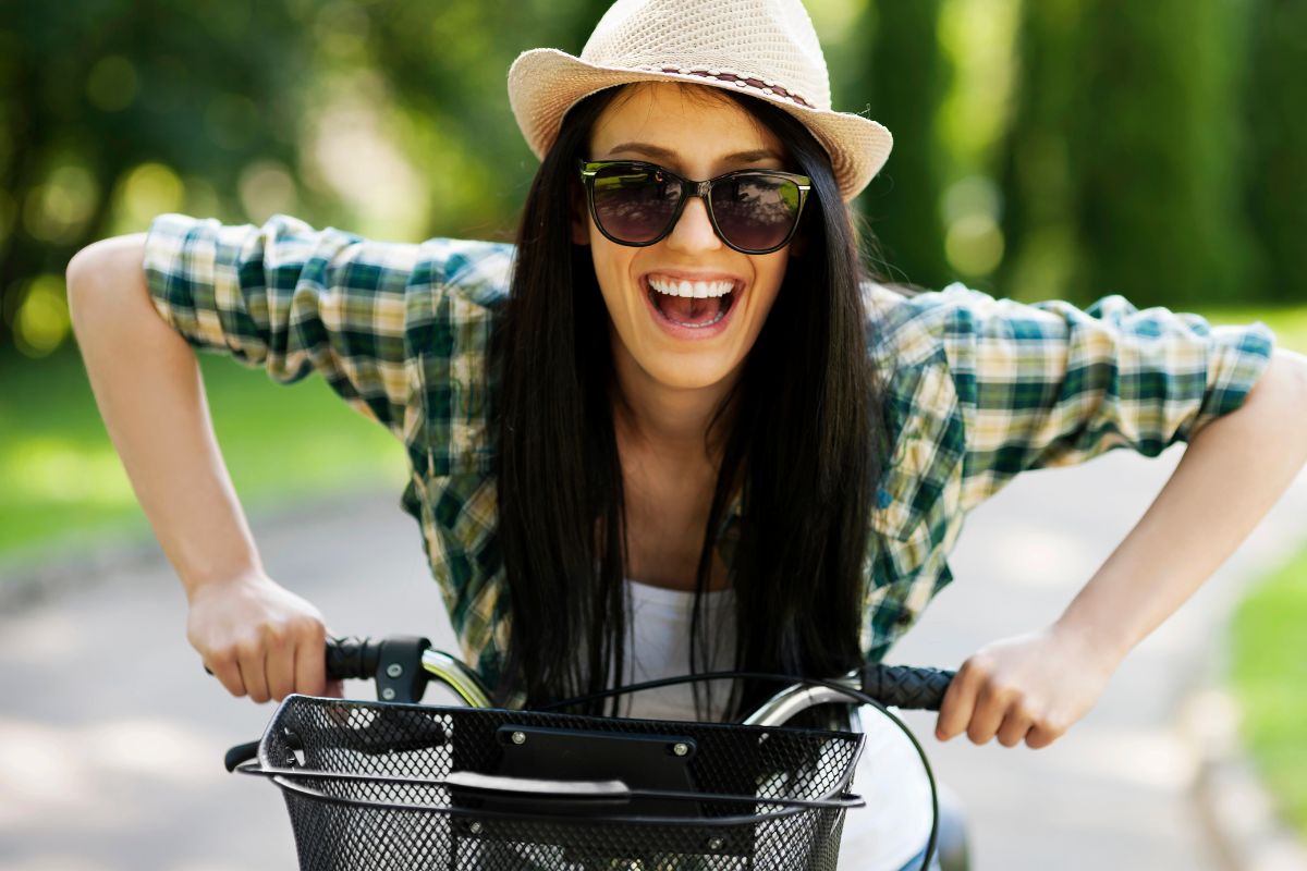 woman on a bike happy