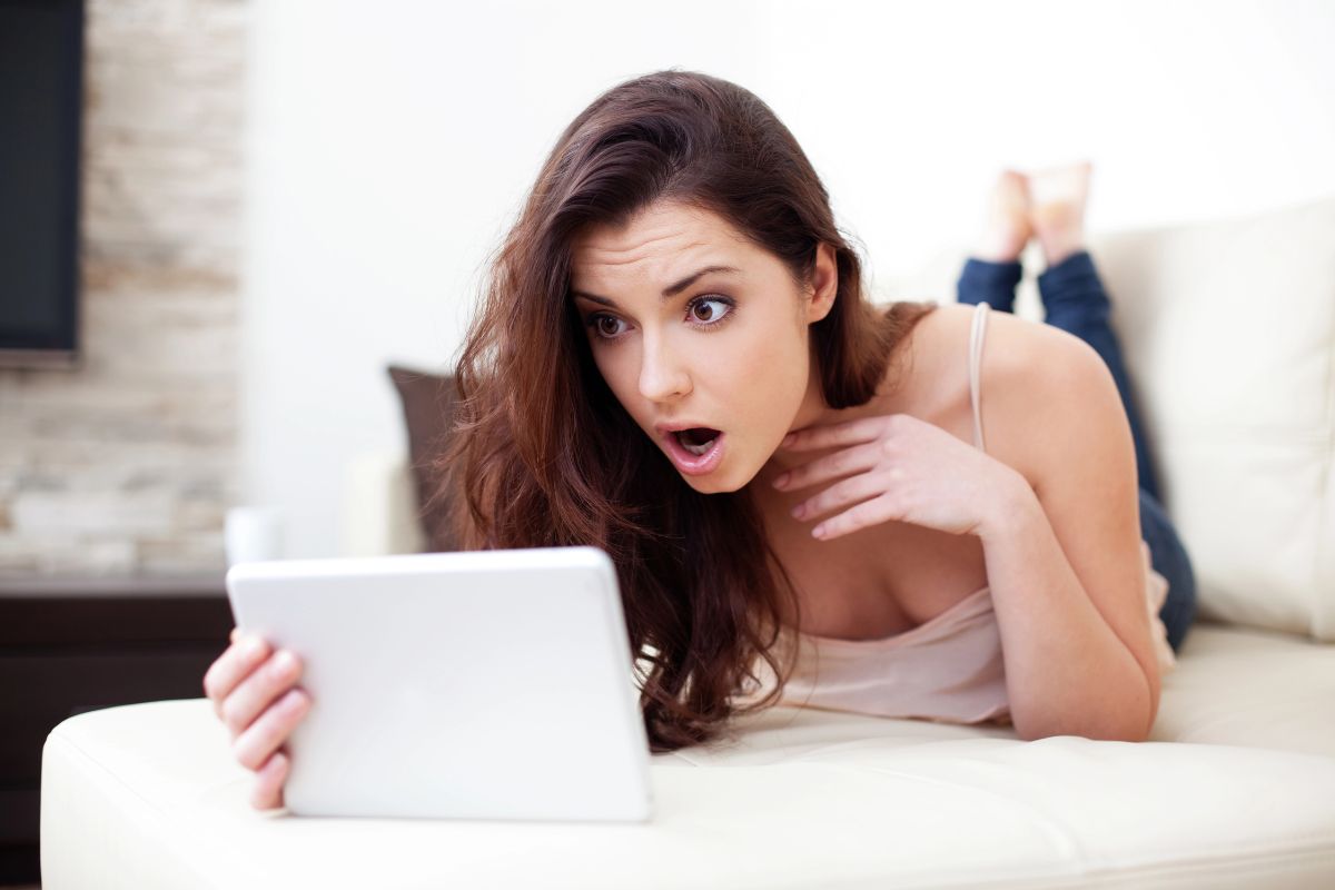 woman shocked on her laptop