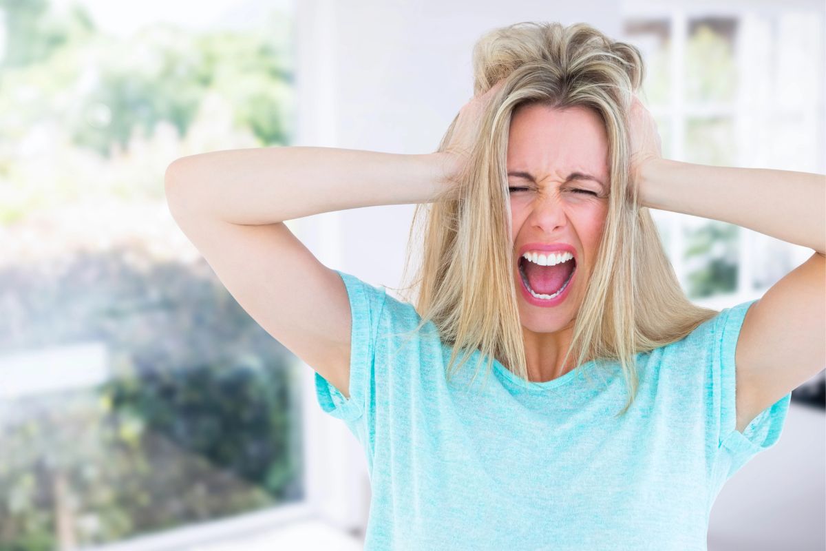 Woman hands on her head.