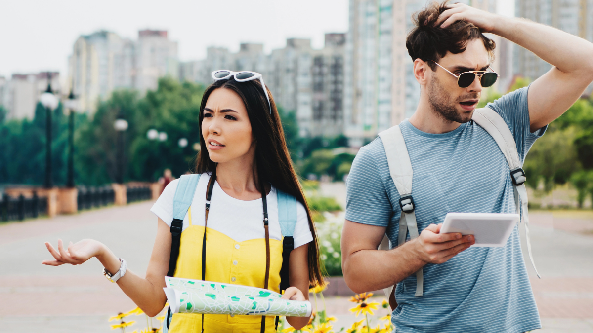 couple confused with map