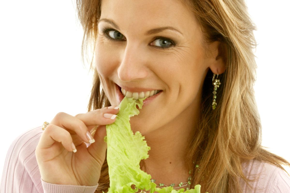 eating a piece of lettuce