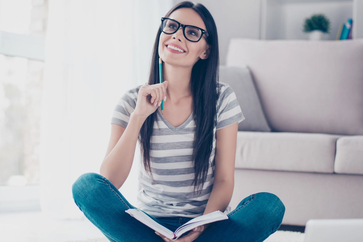happy woman thinking sitting in the living room