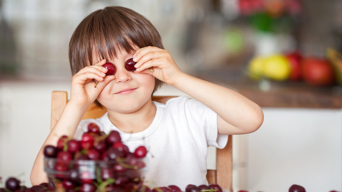kid with grapes
