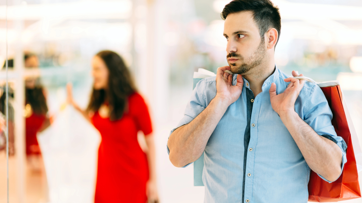 man annoyed while shopping