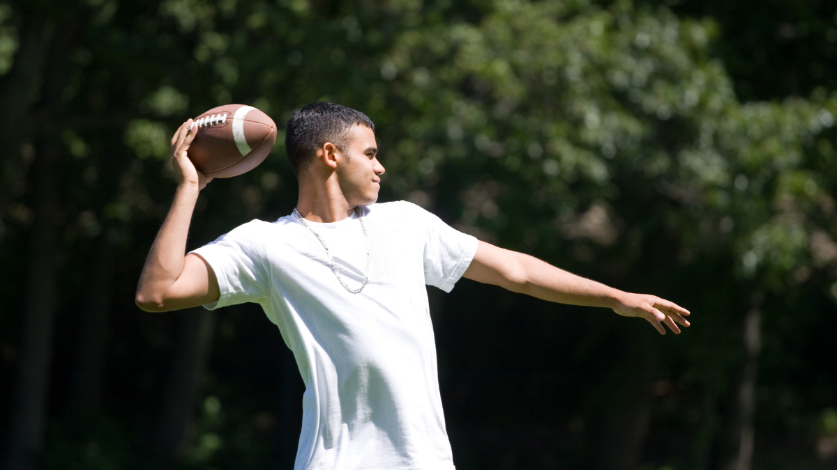 man throwing football