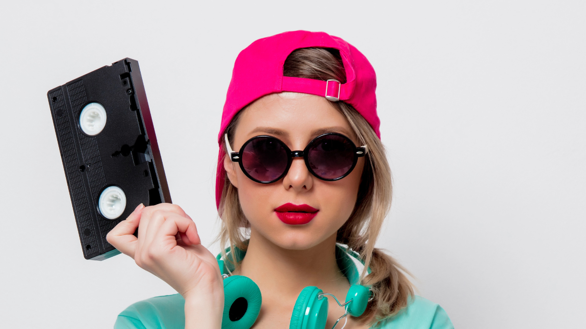 Woman with glasses and vhs tape