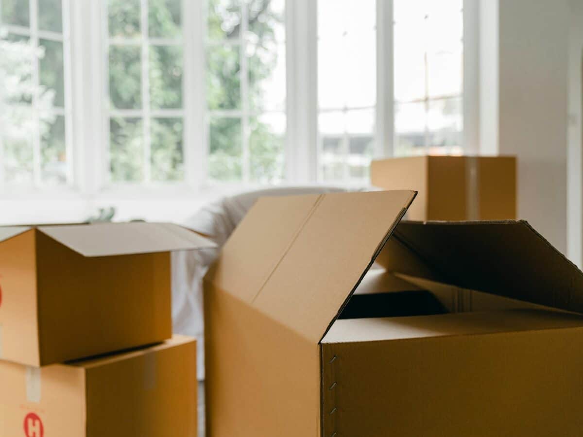Unpacked boxes in middle of room