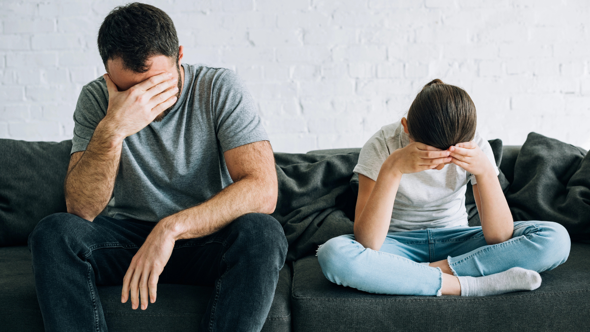 upset father and daughter