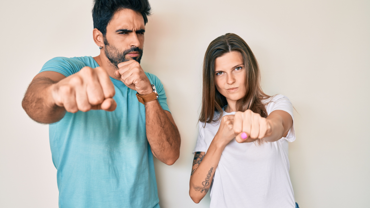 woman and man punching