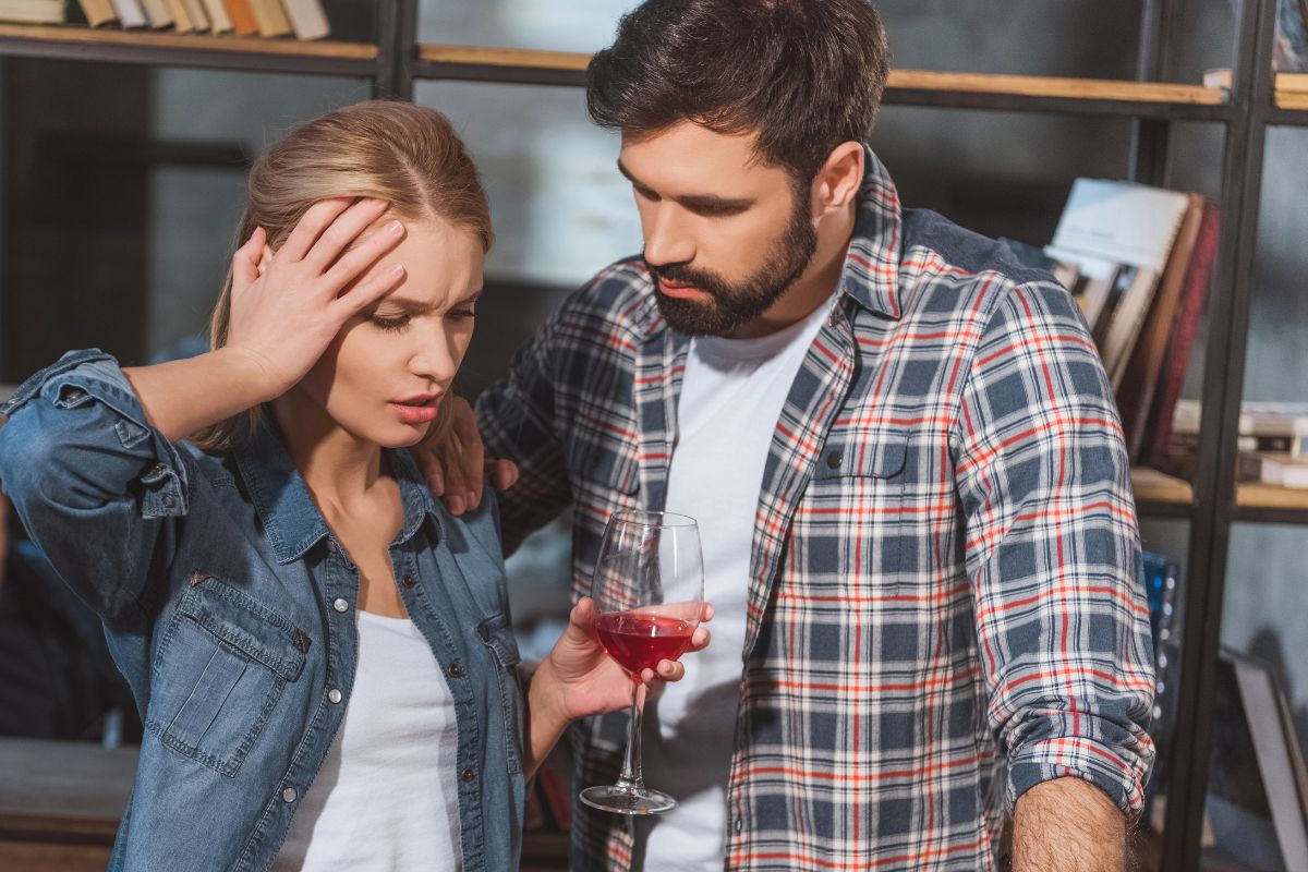 woman annoyed with man beside her in the kitchen