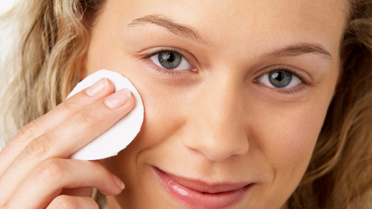 woman cleaning face