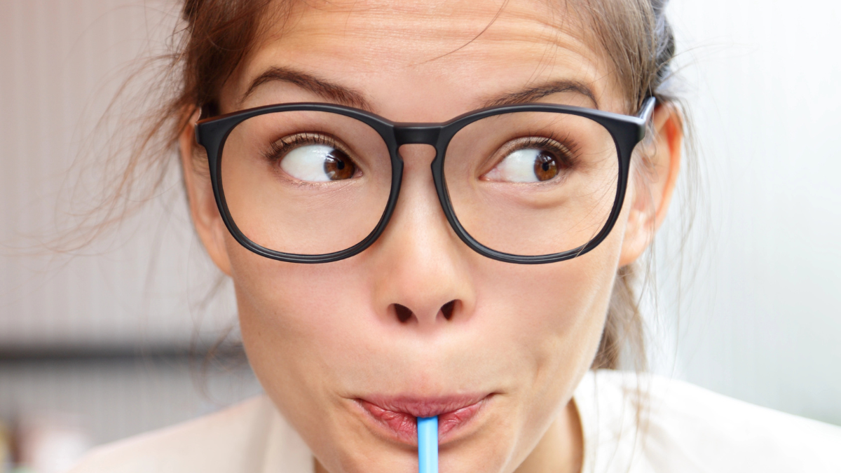 woman drinking a smoothie