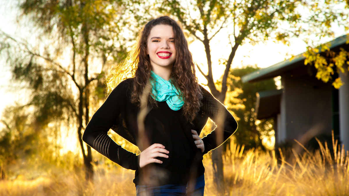 woman in field smiling