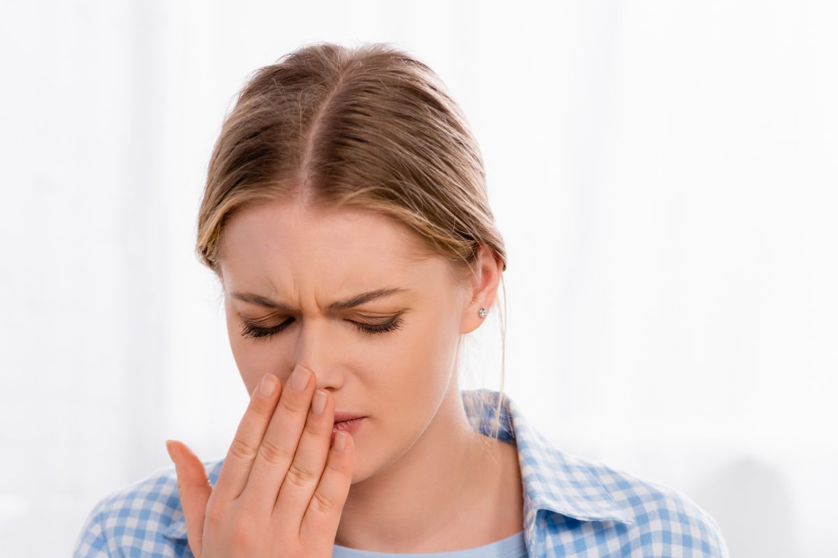 woman looking grossed out