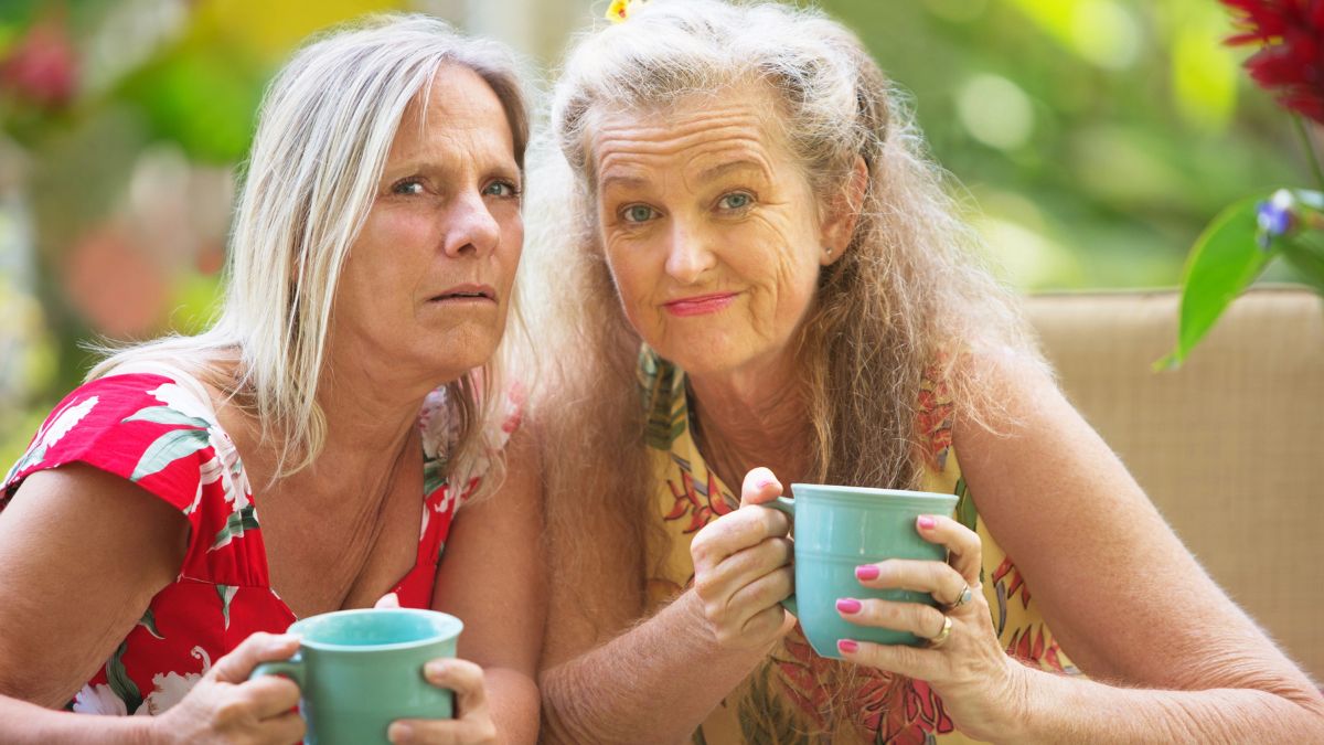 confused women with coffee mugs