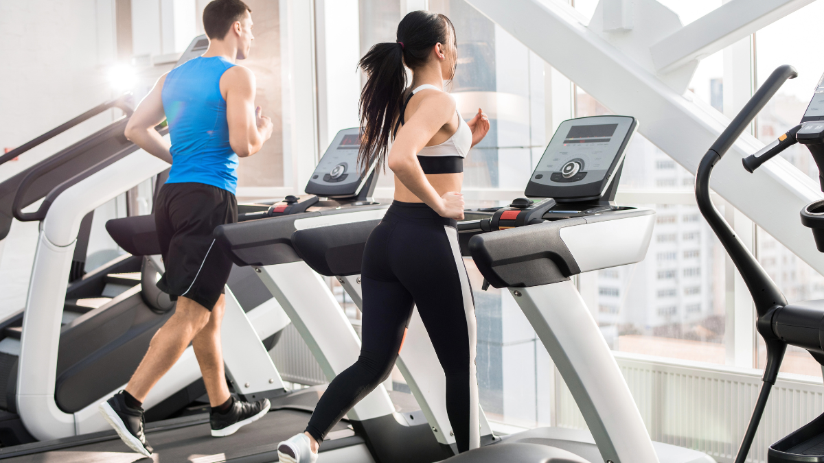 couple running on treadmill